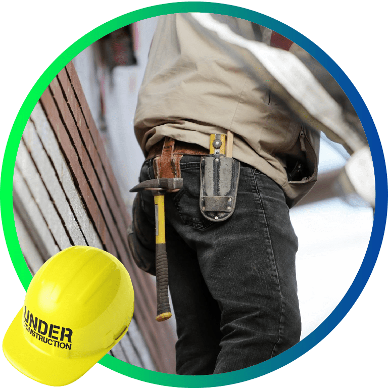 A handyman's hips with tools attached to him
