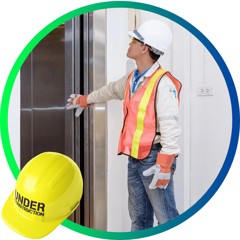 A man in a hard hat checking the elevator
